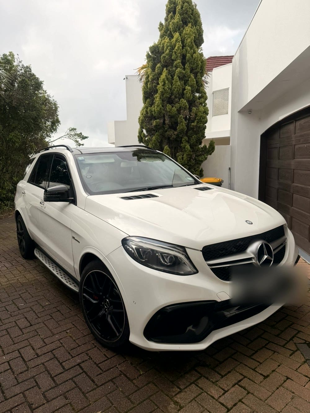 Mercedes-Benz GLE63 AMG parked in a residential driveway, clean and glossy finish