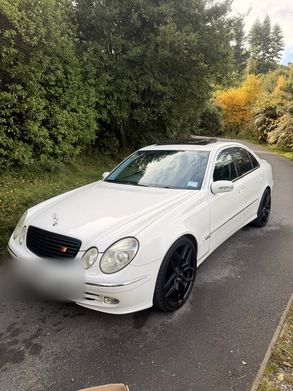 Mercedes-Benz E-Class sedan, exterior, glossy white paintwork